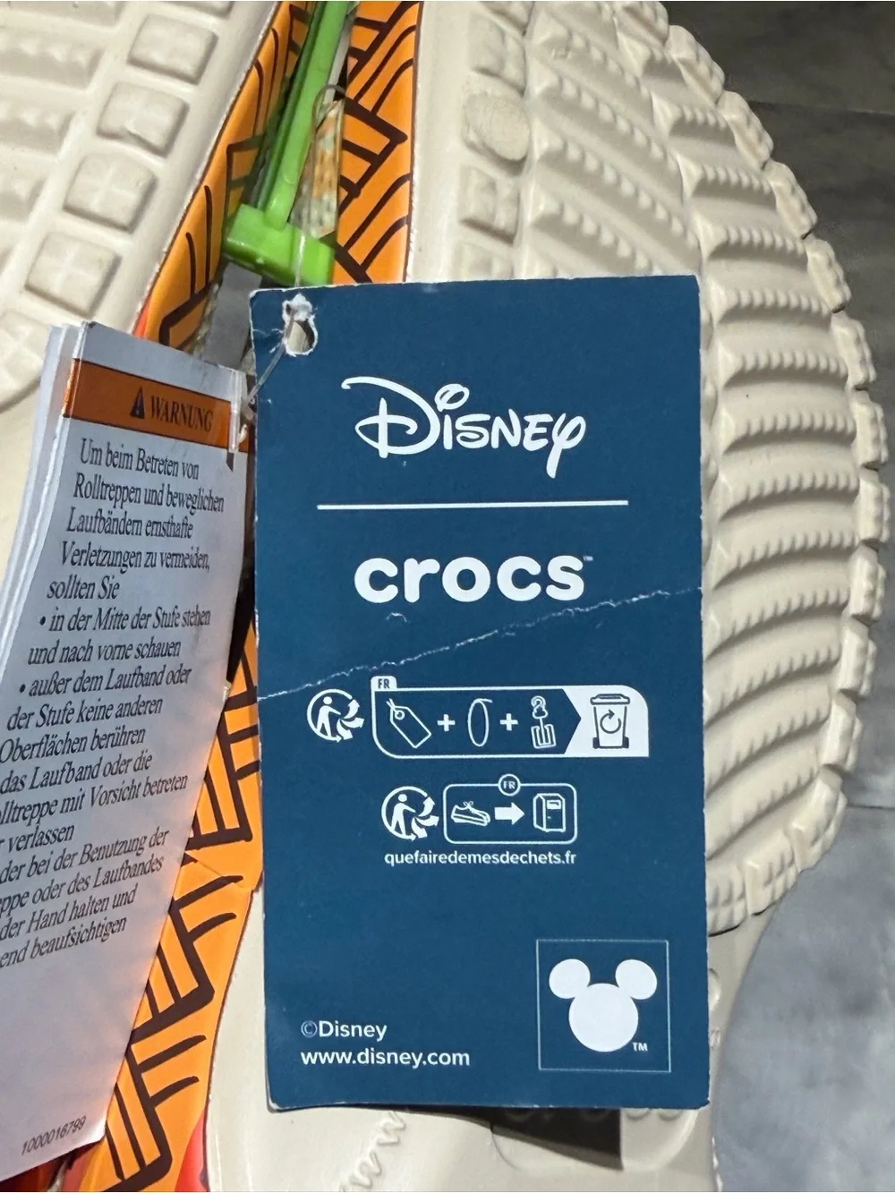 CROCS Kids Beige Orange Floral Moana Themed Clogs with Blue and orange Charms